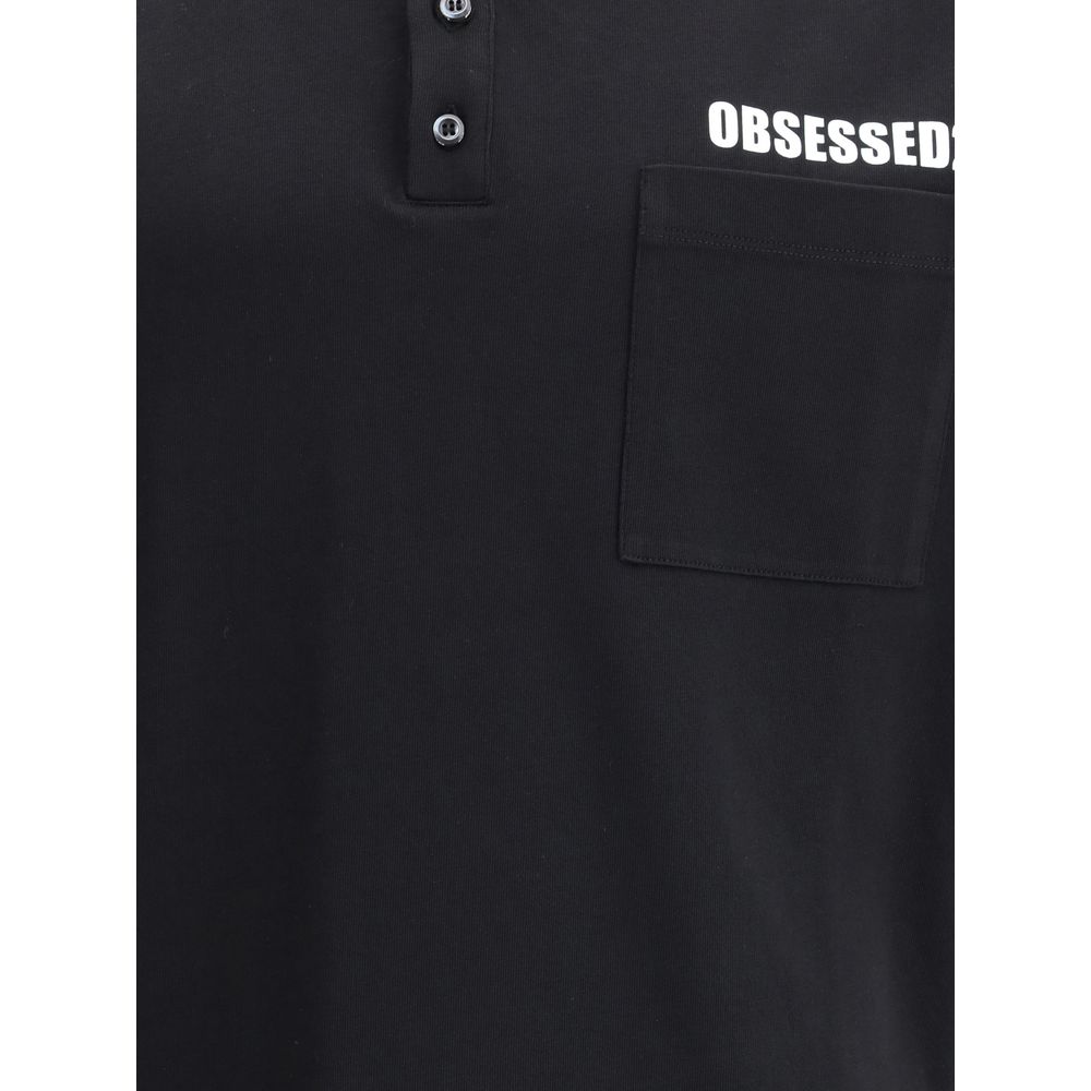 Close-up of Dsquared² Black Cotton Polo Shirt featuring a patch pocket and 'Obsessed' text.
