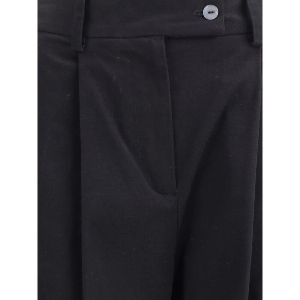Close-up of Ella Black Cotton Casual Pants showcasing front pleats, zip button closure, and wide leg design for an elegant silhouette.