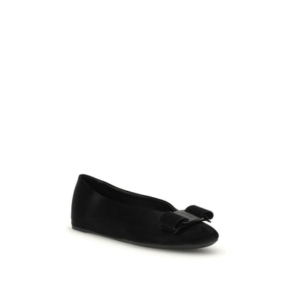 Ferragamo Black Calf Leather Bos Taurus Ballet Flats with bow detail, elegant and versatile design for women.