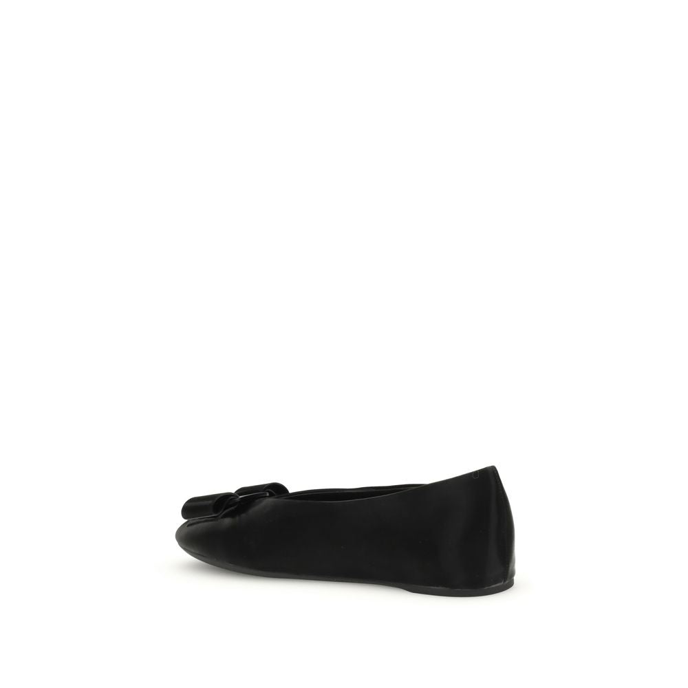 Side view of Ferragamo Black Calf Leather Bos Taurus Ballet Flats with Vara bow, showcasing elegant and versatile design.