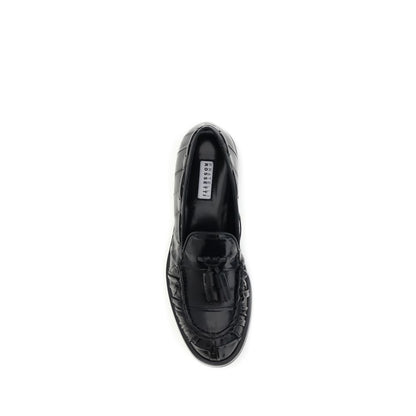 Fratelli Rossetti Black Rubber Slip-On Loafers with tassels, top view showcasing round toe and leather craftsmanship.