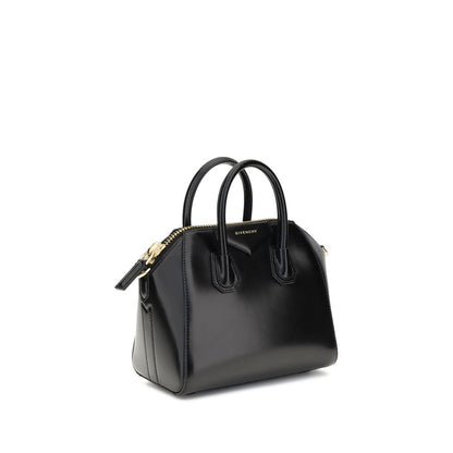 Givenchy Black Calf Leather Bos Taurus Handbag with glossy finish and geometric pattern, featuring top handles and an adjustable shoulder strap.