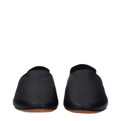 Front view of Givenchy Black Leather Slides showcasing the round toe and casual style, with side and back logos visible.