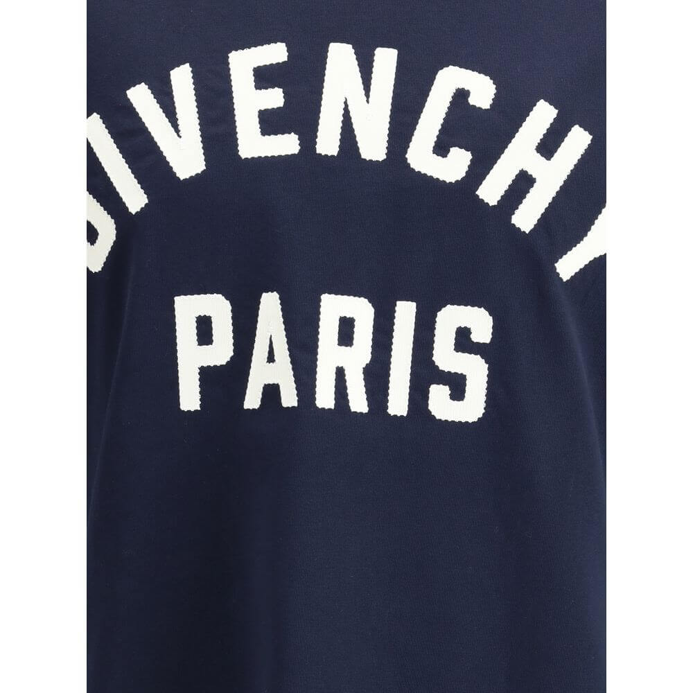 Givenchy Blue Cotton T-Shirt with Paris logo front view detail, showcasing soft cotton fabric and iconic ribbed crew neck for AW25.