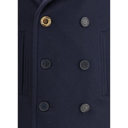 Givenchy Blue Wool Coat close-up showing double-breasted button design and front welt pockets for AW25 collection.