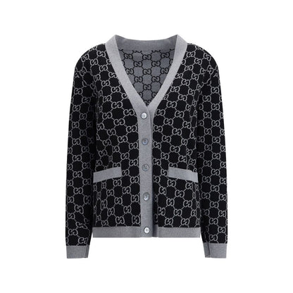Gucci Black Wool Cardigan with GG pattern, V-neckline, long sleeves, front pockets, ribbed trim, reversible jacquard, perfect for smart looks.