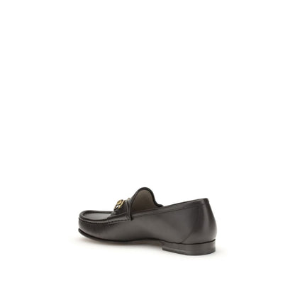 Gucci Brown Calf Leather Bos Taurus Slip-On Loafers with Horsebit detail in dark brown leather, side view.