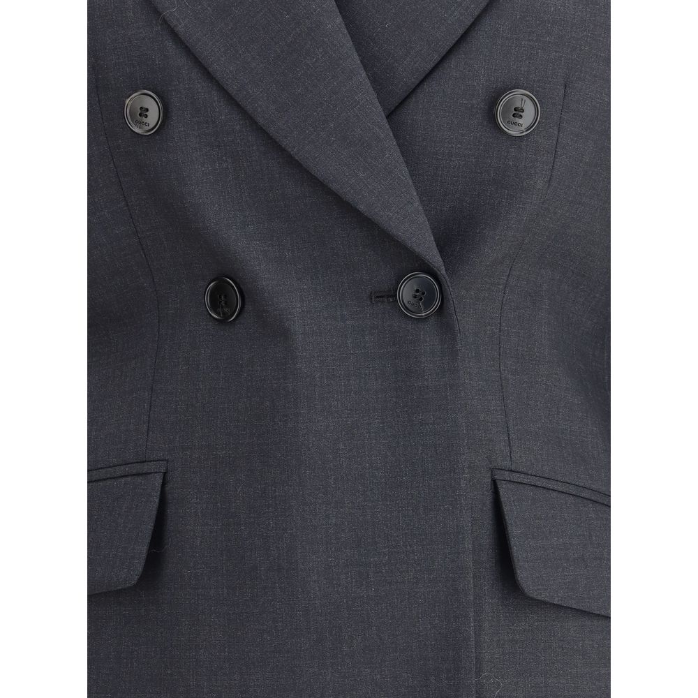 Gucci Gray Wool Clothing: double-breasted blazer with spear lapels and flap pockets, classic and bold in style.