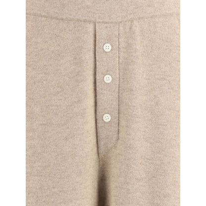 Close-up of Guest in Residence Beige Cashmere Casual Pants with button detail.