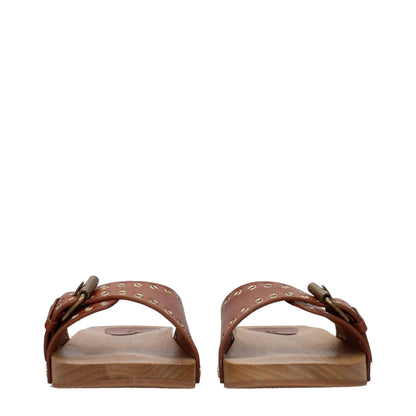 Isabel Marant Brown Leather Slippers with open toe and buckle closure, featuring rubber sole and flat heel. Style: Casual. MPN: SO0003FAA1C67S50CO.