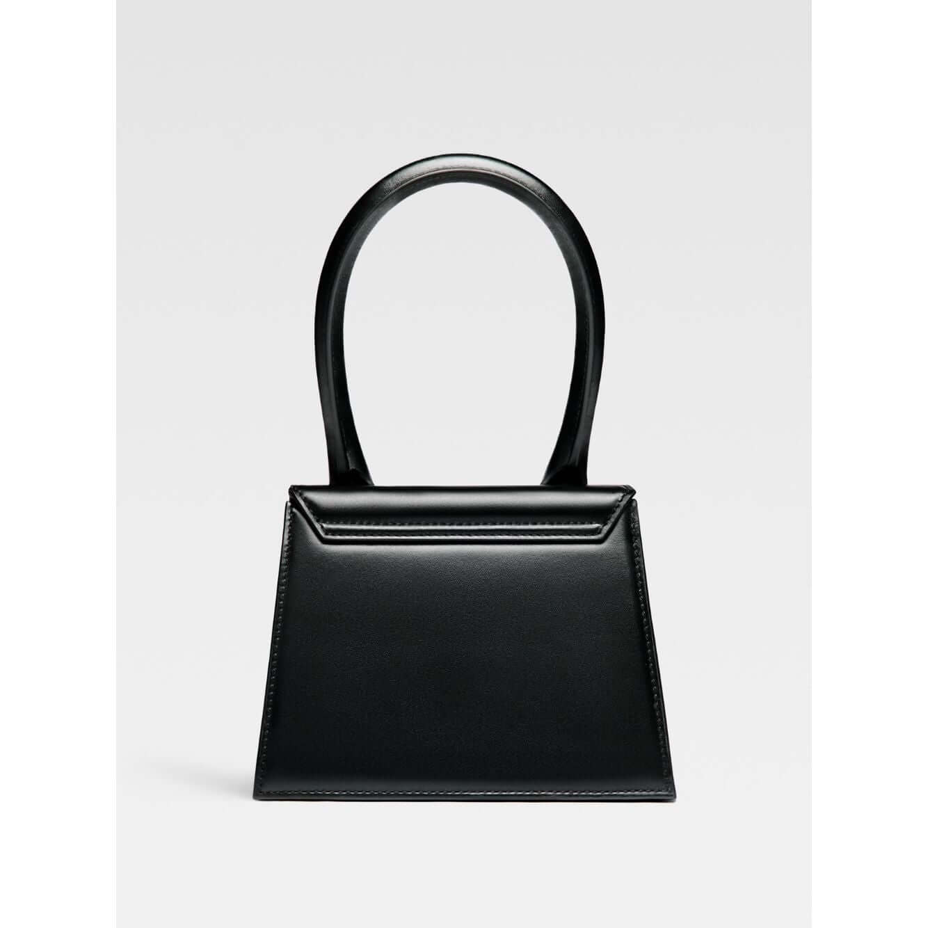 Jacquemus Le Chiquito Moyen Black Bag with gold hardware, reinforced handle, removable shoulder strap, and magnetic flap closure.