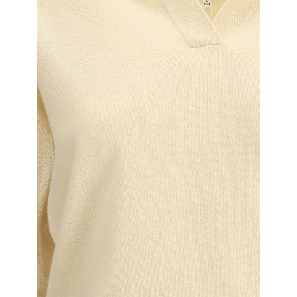 Margiela Cream Fleece Wool Sweater featuring a classic collar and ribbed hem, made from 100% virgin wool for elegance and comfort.
