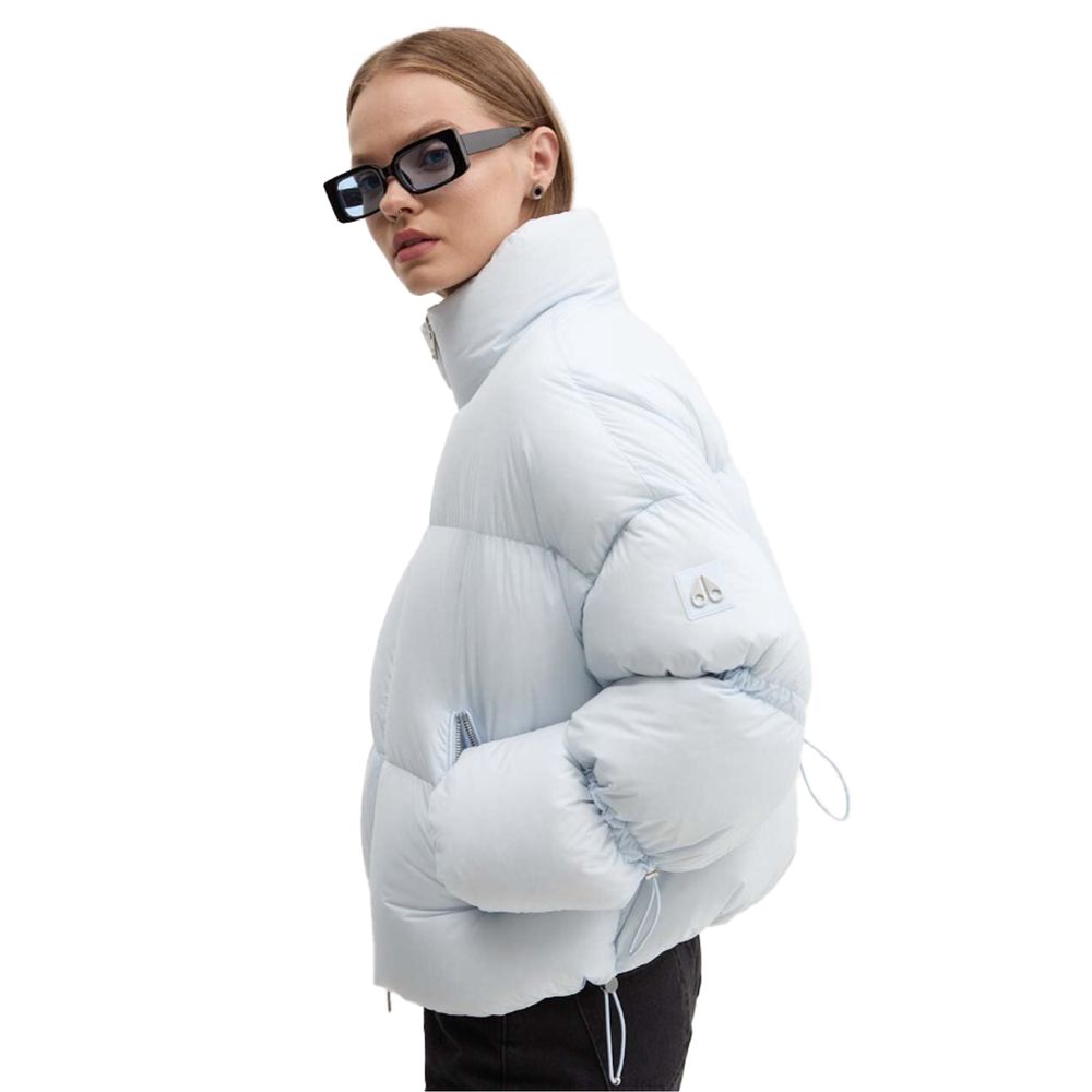 Moose Knuckles Light Blue Nylon Women Jacket on model, showcasing stylish and warm design for urban or après-ski settings.