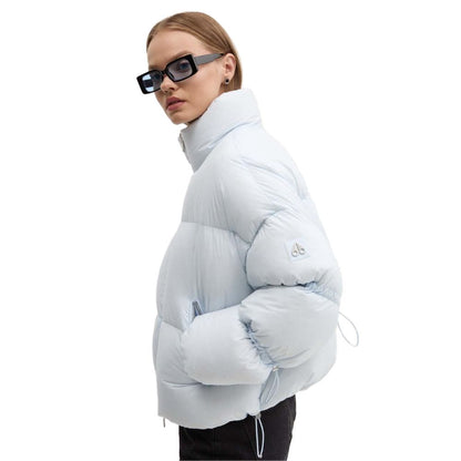 Moose Knuckles Light Blue Nylon Women Jacket on model, showcasing stylish and warm design for urban or après-ski settings.