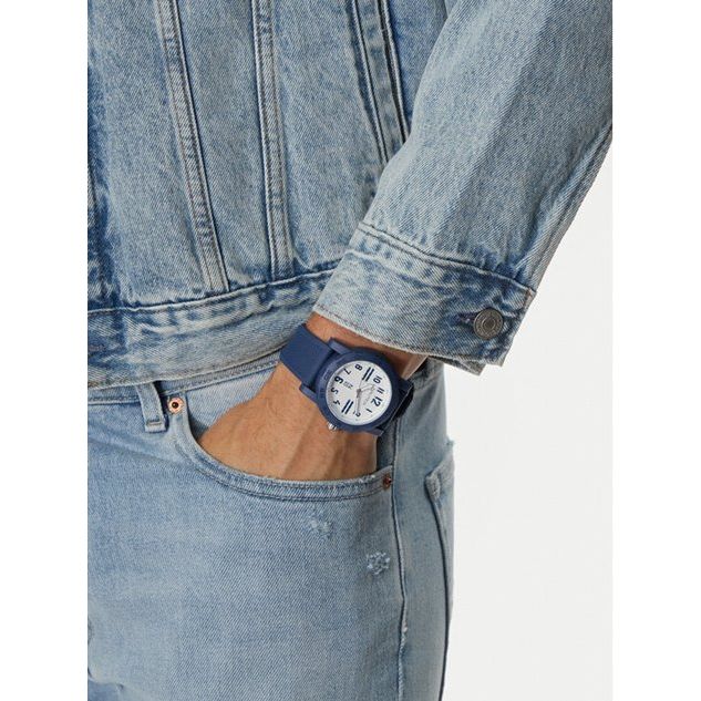 NAUTICA Mod. NAPATS301 gent's quartz analog watch with blue strap and mineral dial, water resistant 5 ATM, shown on wrist with denim jacket.