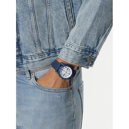 NAUTICA Mod. NAPATS301 gent's quartz analog watch with blue strap and mineral dial, water resistant 5 ATM, shown on wrist with denim jacket.