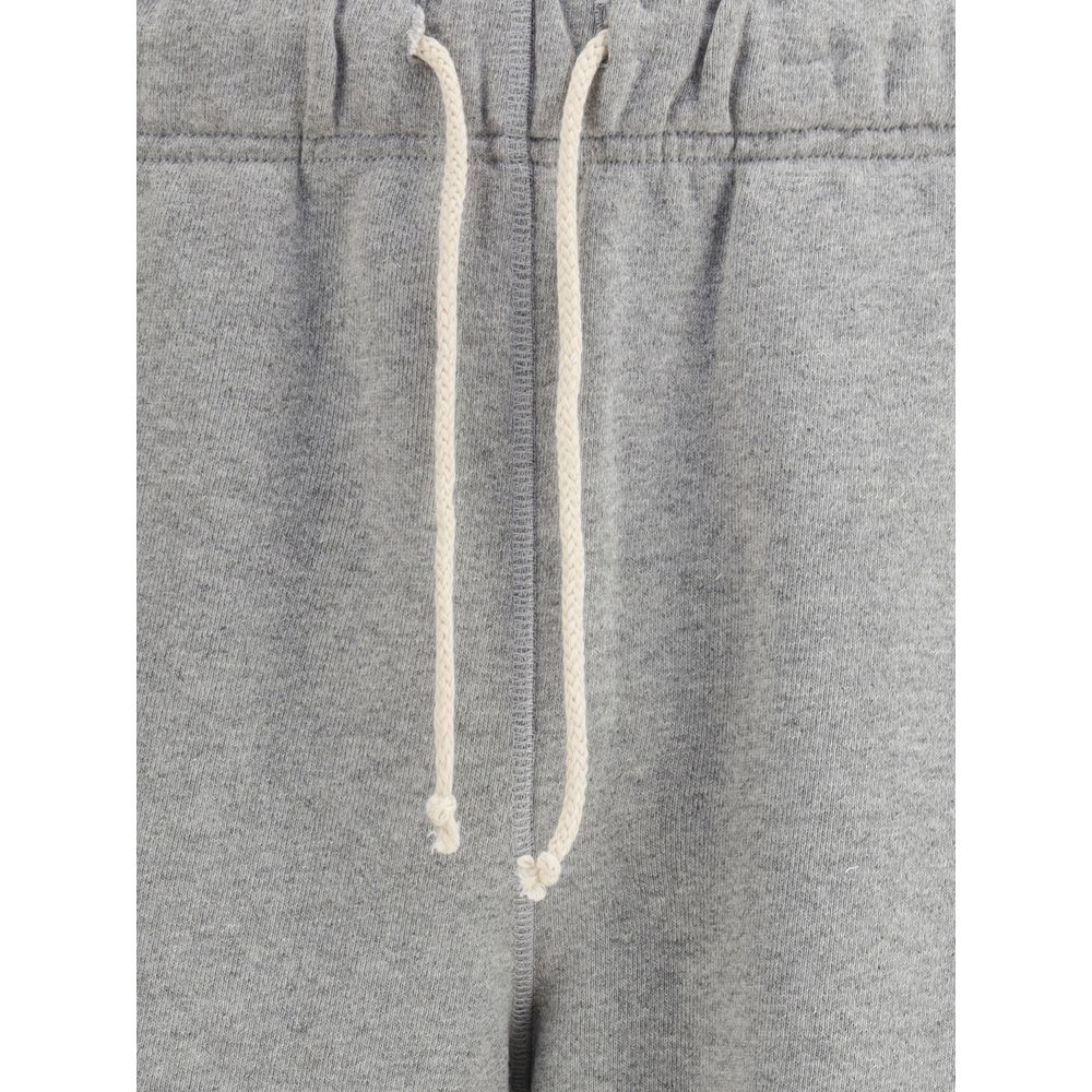 Close-up of New Balance Gray Cotton Joggers (Workout Pants) showing adjustable drawstring and elastic waistband detail.