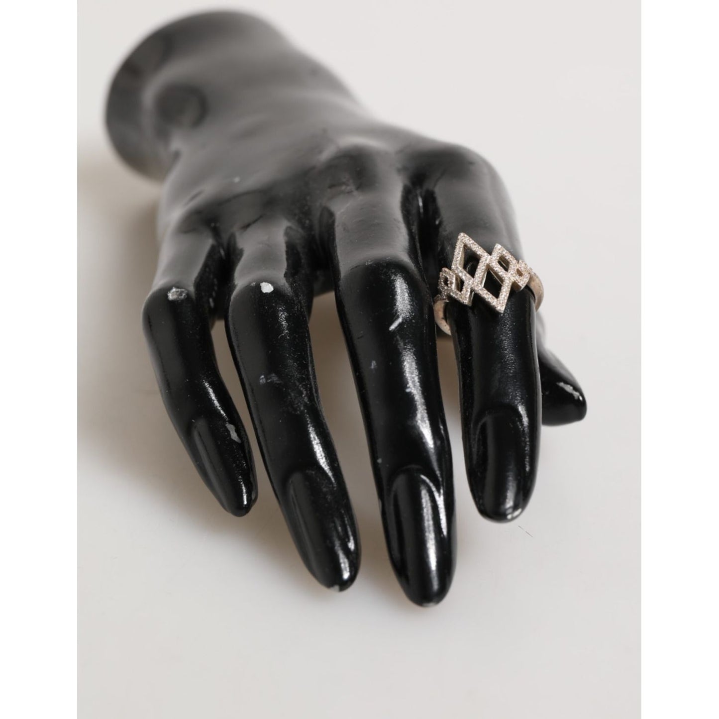 Nialaya Geometric Diamond Shape Pave CZ Crystal Jewelry Ring in gold on black mannequin hand, 925 silver with cubic zirconia.