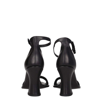 Rear view of Premiata Black Leather Sandals with high heel and buckle closure, featuring a vintage effect and side logo.