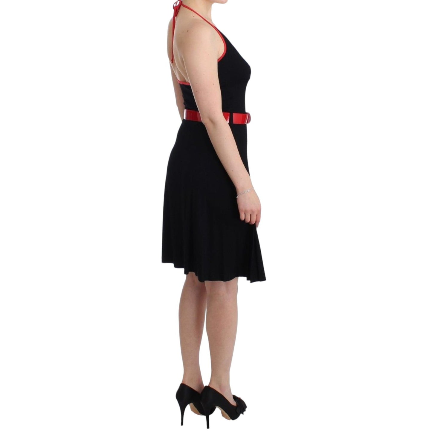 Model wearing Roccobarocco Black belted palladio dress with knee-length design, red belt, and round neckline, showcasing side profile.