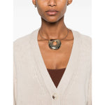 Model wearing SOFT GOAT Sweaters Ivory ribbed trim cashmere cardigan with plunging v-neck and front button fastening.
