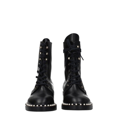 Stuart Weitzman Black Leather Ankle Boots with beaded details, lace-up closure, punk rock style, and rubber sole.