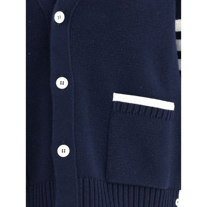 Close-up of Thom Browne Blue Merino Wool Cardigan showing buttons and patch pocket with contrasting piping.