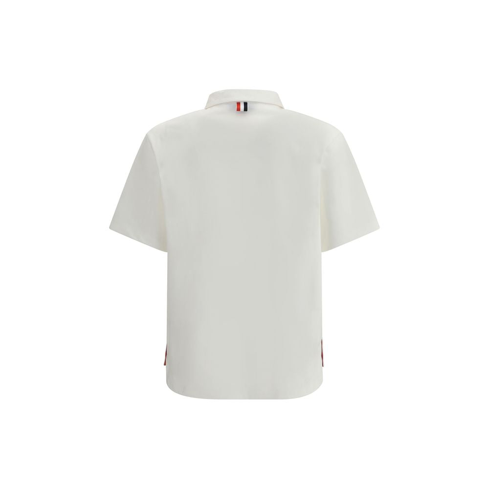 Back view of Thom Browne White Cotton Polo Shirt with traditional collar and signature embroidered patch pocket.