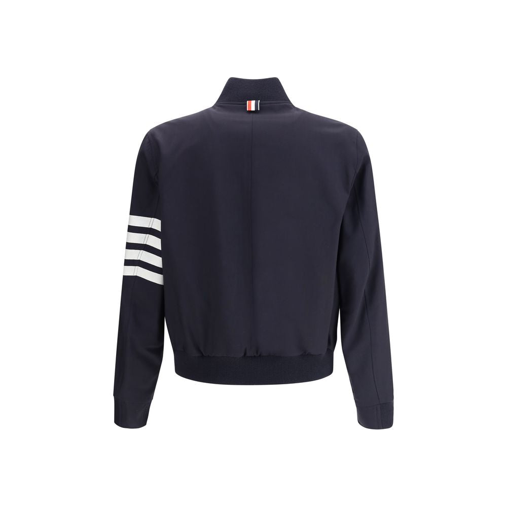 Back view of Thom Browne Wool Jacket with ribbed collar, horizontal band on sleeve, and welt pockets.