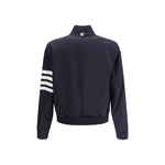 Back view of Thom Browne Wool Jacket with ribbed collar, horizontal band on sleeve, and welt pockets.