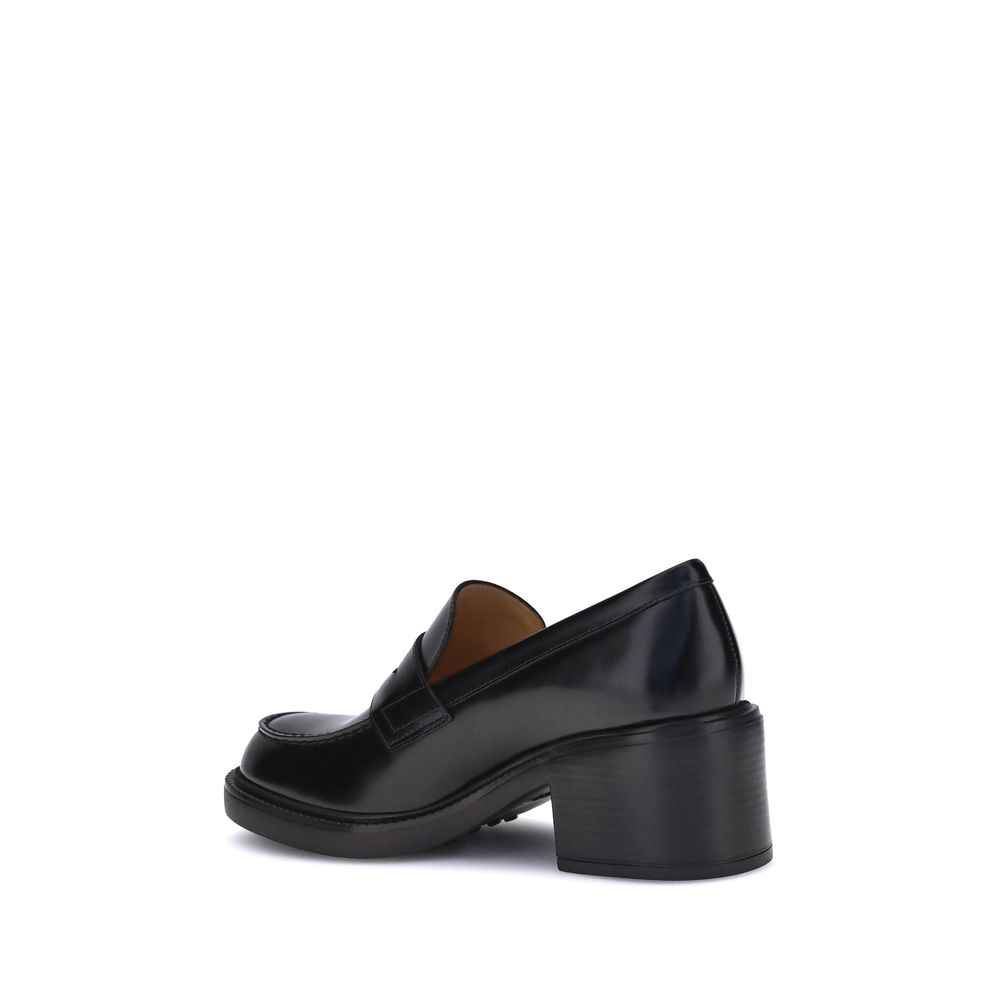 Side view of Tod's Black Calf Leather Bos Taurus Platform Loafers with chunky heel, showcasing elegant and timeless design for AW25 season.