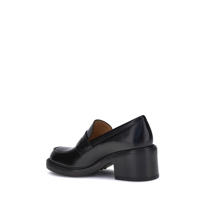 Side view of Tod's Black Calf Leather Bos Taurus Platform Loafers with chunky heel, showcasing elegant and timeless design for AW25 season.