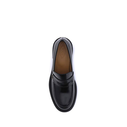 Top view of Tod's Black Calf Leather Bos Taurus Platform Loafers showcasing sleek design and quality craftsmanship.
