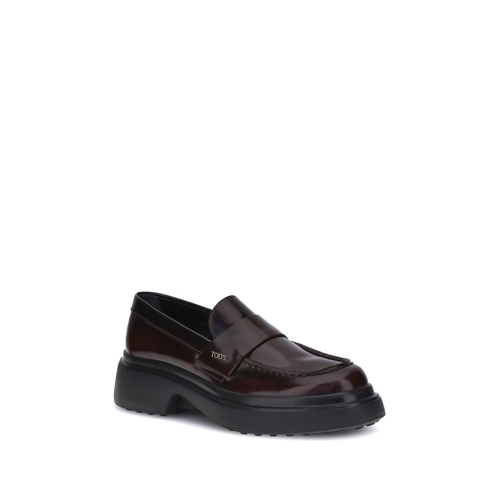 Tod's Brown Rubber Platform Loafers with patent leather and distinctive side logo plaque. Made in Italy, AW25 season.