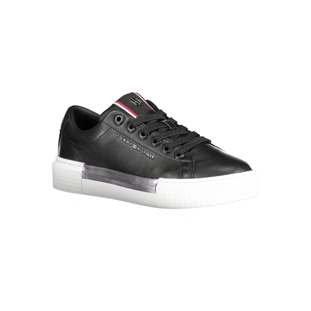 Tommy Hilfiger Black Leather Women Sneaker with contrasting sole and iconic logo details, stylish and versatile for any casual outfit.
