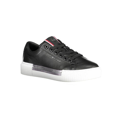 Tommy Hilfiger Black Leather Women Sneaker with contrasting sole and iconic logo details, stylish and versatile for any casual outfit.