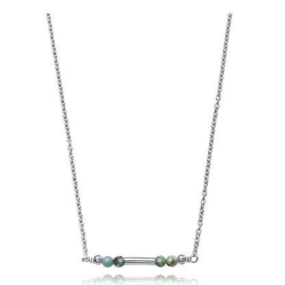 Delicate silver chain necklace with green beads and bar detail, minimalist jewelry design.