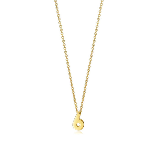 Gold necklace with a number six pendant on a chain, stylish jewelry accessory.