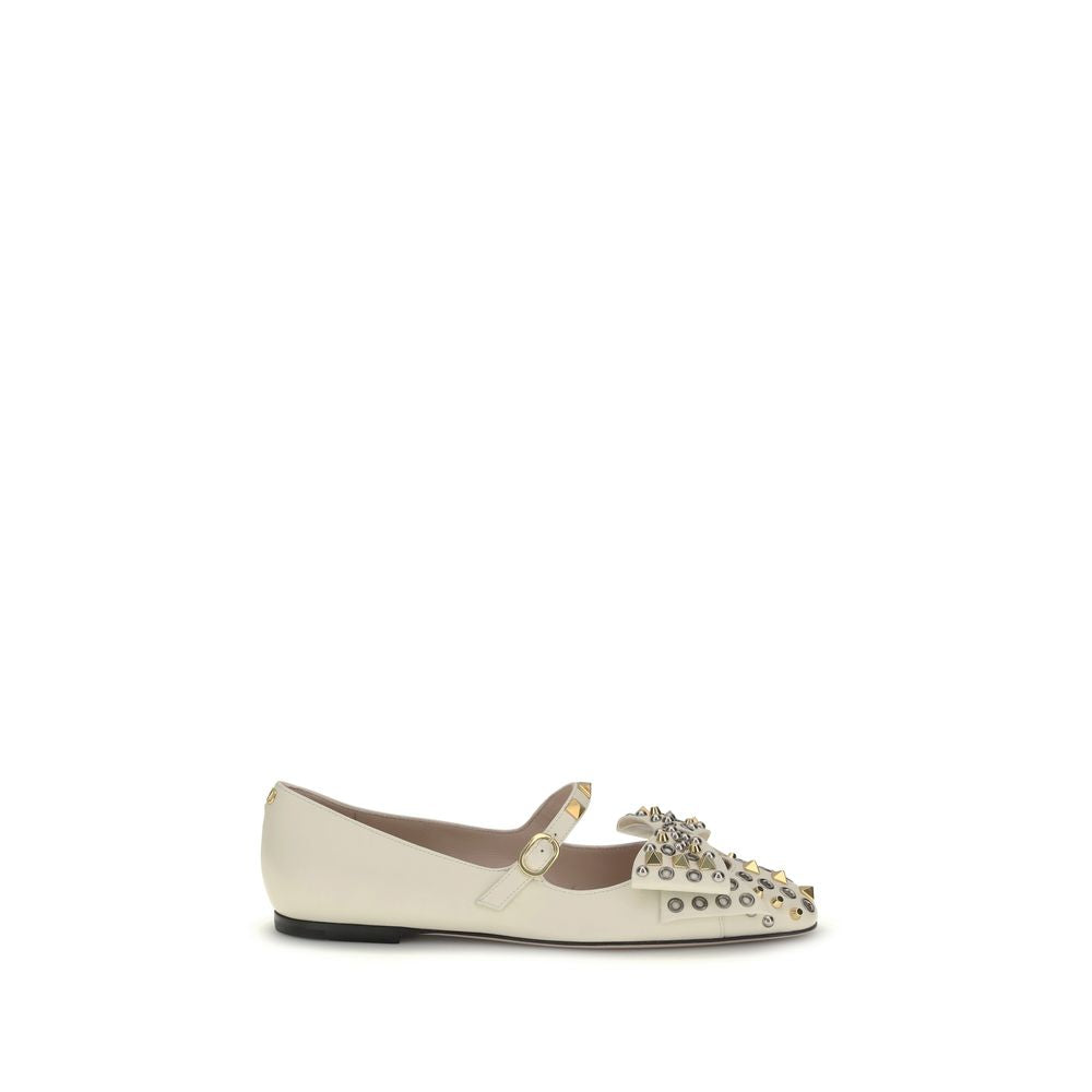 Valentino Garavani Cream Goatskin Ballet Flats with studs and bow on side view.