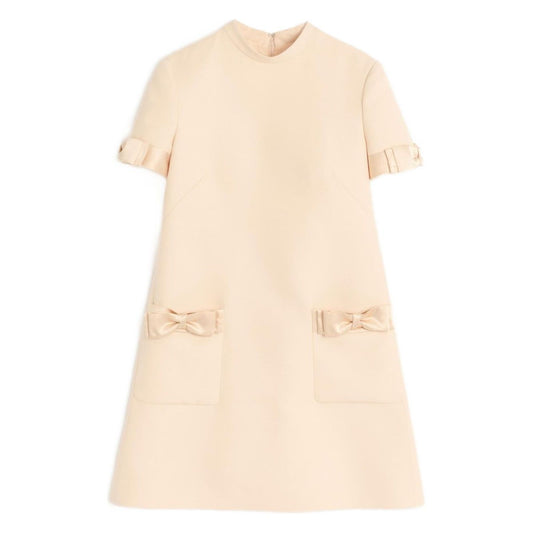 Valentino Short Crepe Couture Dress, beige with bow detailing, wool and silk blend, crew neck, rear zip fastening.