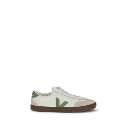 Veja White Leather Low Top Sneakers with green "V" logo, inspired by 1970s volleyball shoes, featuring a flat sole and lace-up design.