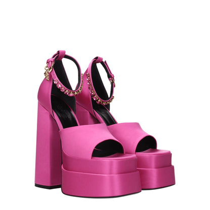 Versace Pink Satin Platform Sandals with high heels, open toe, rhinestone detail, and buckle closure in fuchsia satin and leather sole.