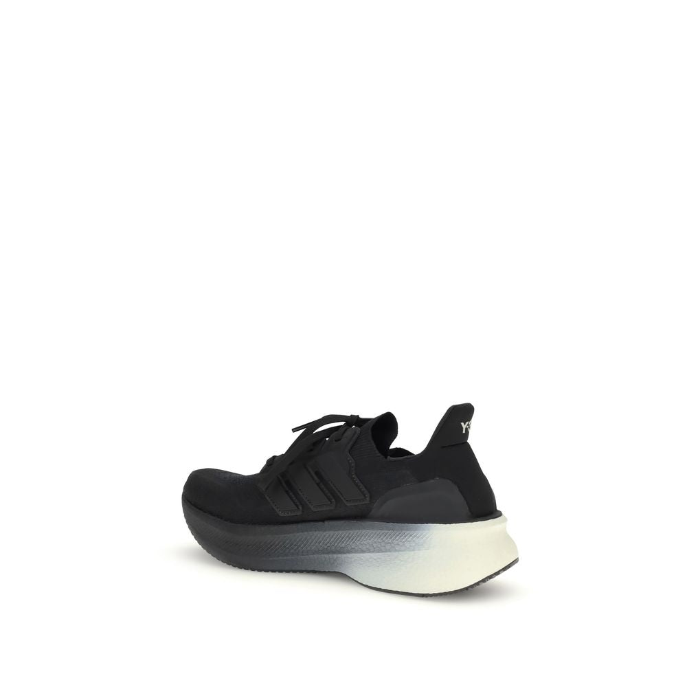 Side view of Y-3 Black Fabric Athletic Sneakers with canvas upper and Y-3 logo detailing, showcasing modern sporty design.