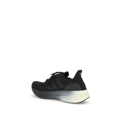 Side view of Y-3 Black Fabric Athletic Sneakers with canvas upper and Y-3 logo detailing, showcasing modern sporty design.