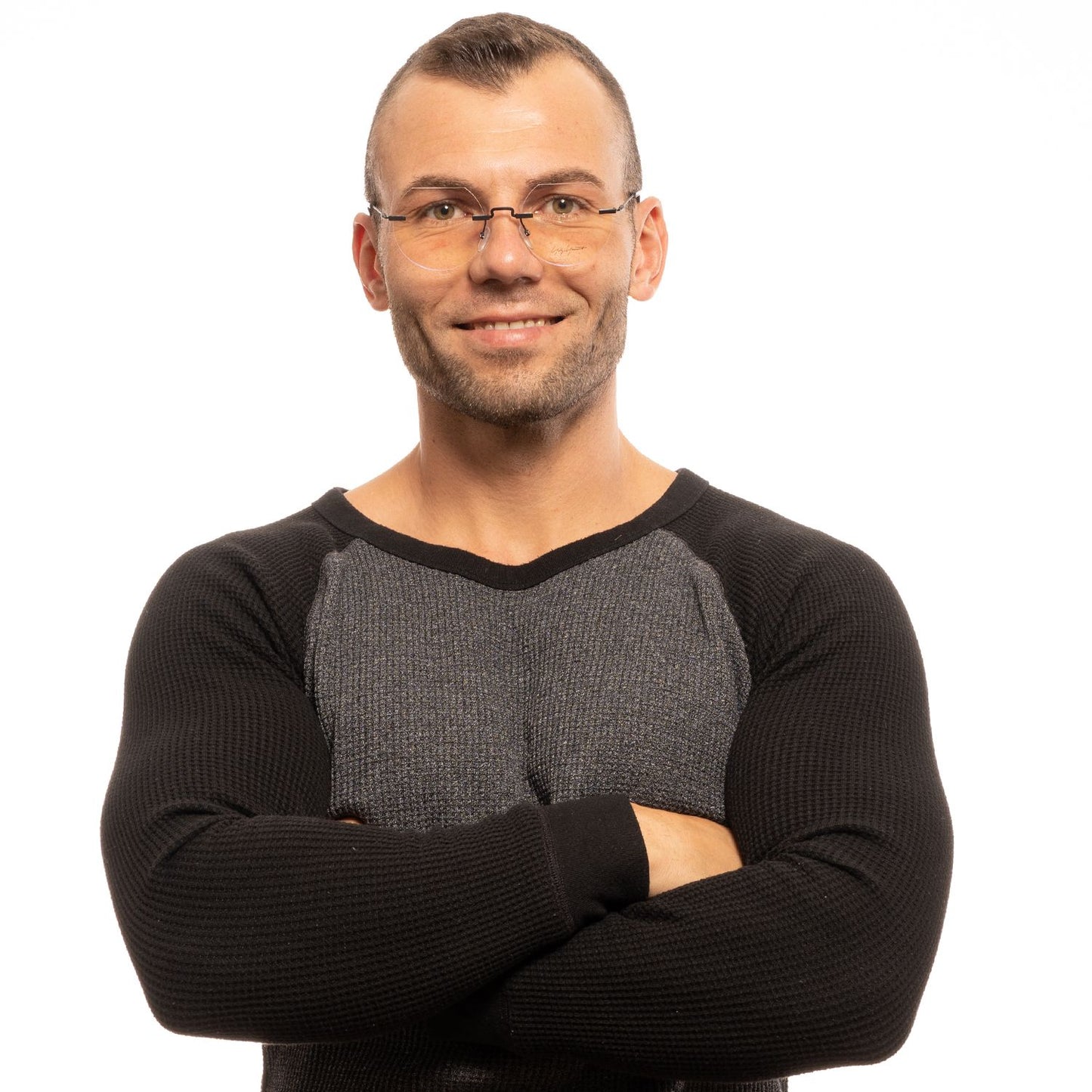 Man wearing Yohji Yamamoto Black Metal Glasses (Frames) with round rimless design and plastic lenses.