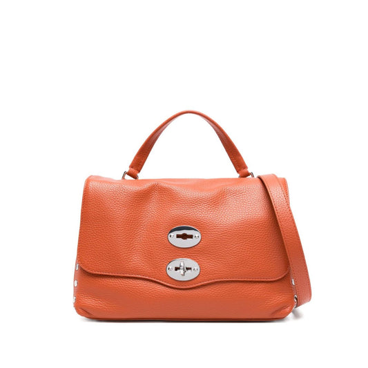 Zanellato Postina Daily Small leather handbag in orange with twist-lock fastening, single handle, adjustable strap, and stud detailing.