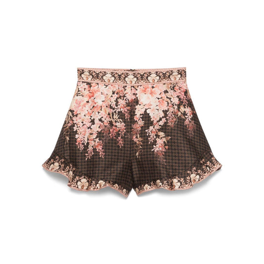 Zimmermann Illuminate Flutter Shorts with black floral print and ruffled trim, featuring a concealed zip fastening, true-to-size fit.