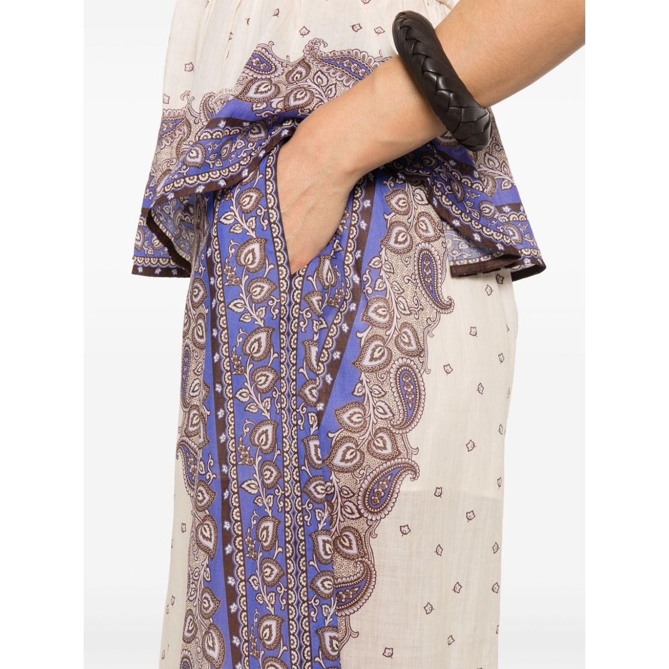 Zimmermann Maxine trousers in ecru with side slit pockets, eco-friendly design featuring blue and brown paisley patterns.